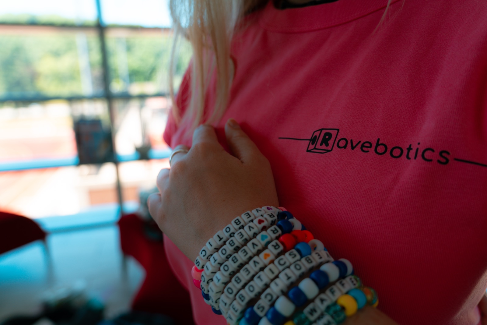 custom RAVEBOTICS bracelets worn on a Ravebotics shirt