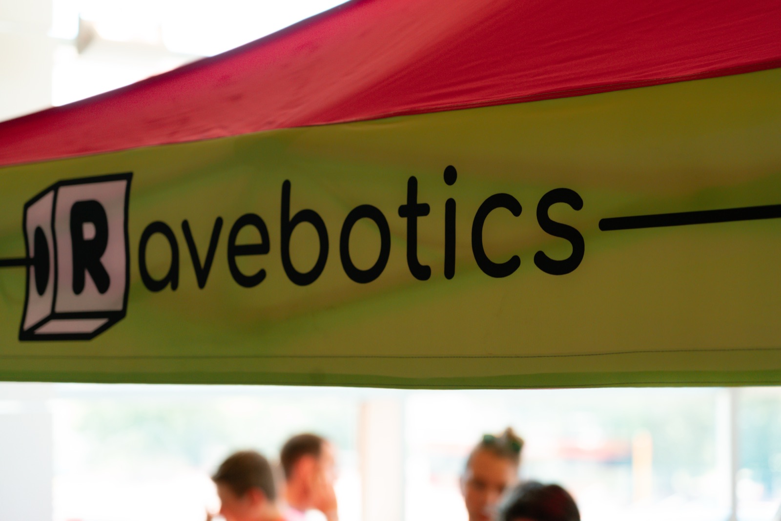 the Ravebotics booth canopy with the logo